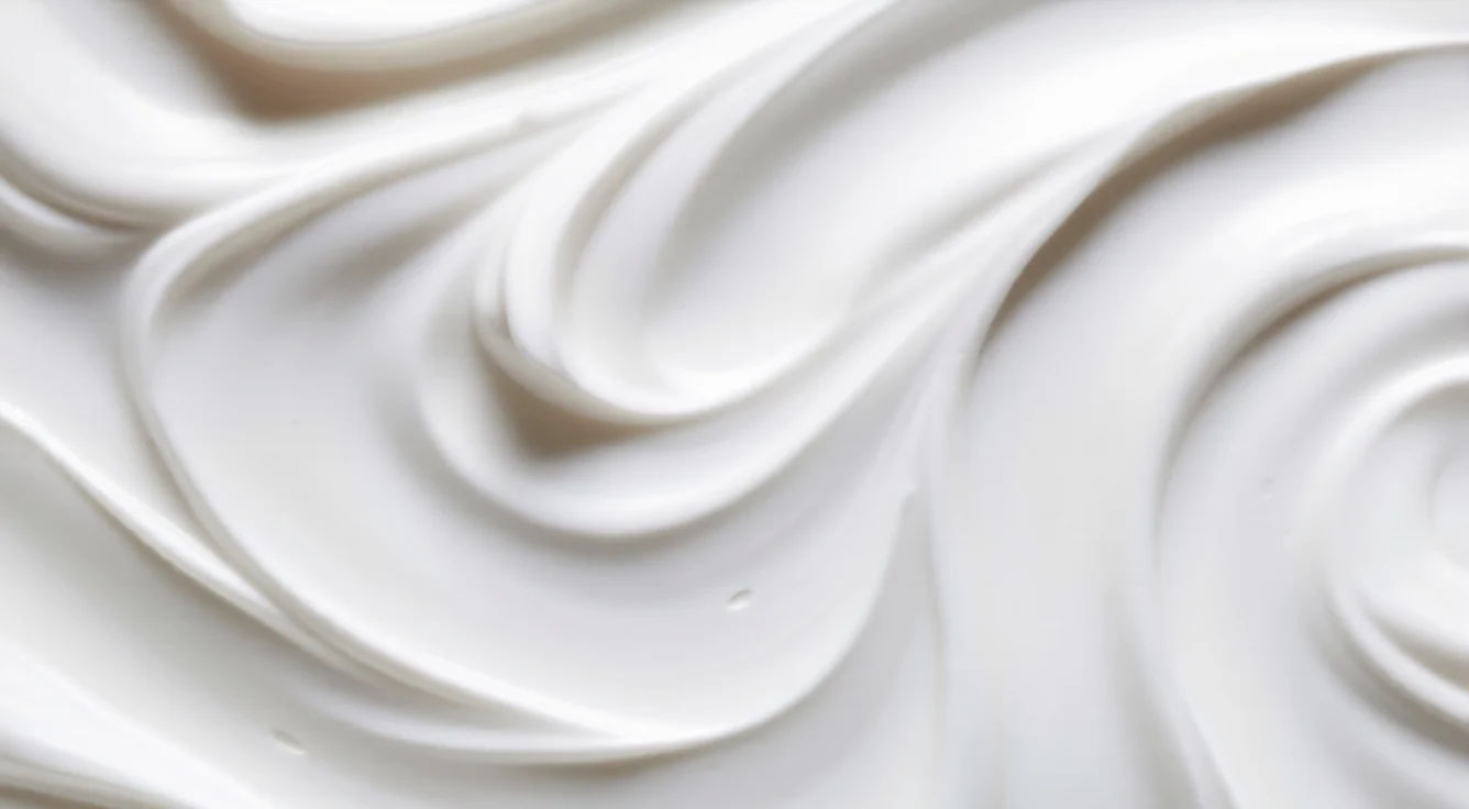 Qemi International cosmetic cream texture close-up showing smooth, stable emulsifier-based formulation with rich consistency